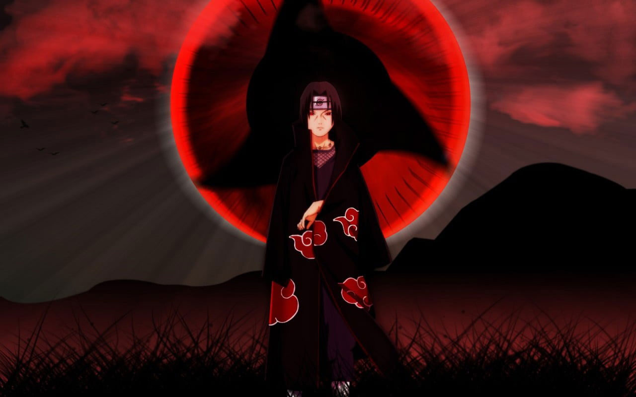 A person in black robe standing on grass - Itachi Uchiha