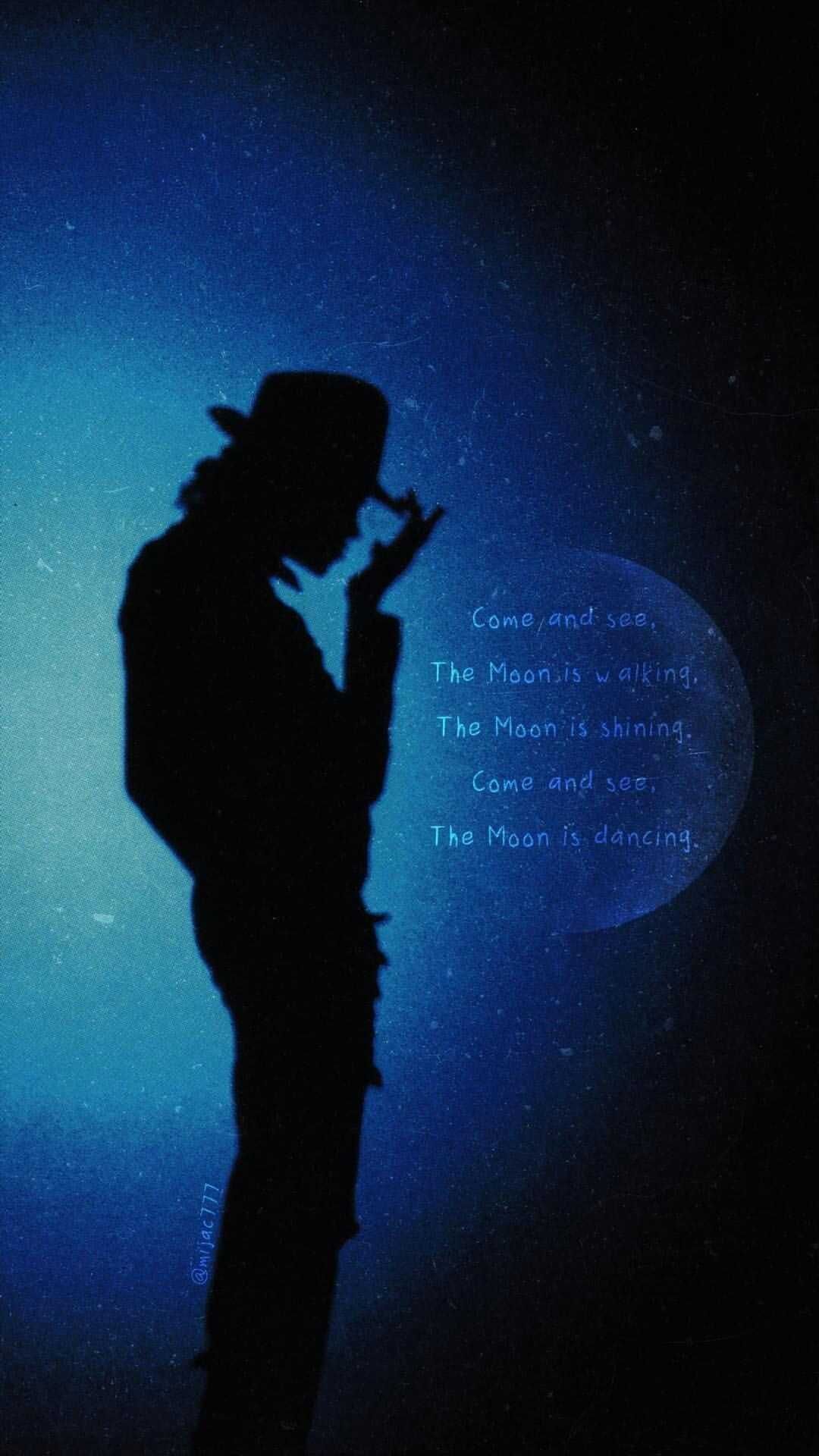 The silhouette of a man in black with his hat on - Michael Jackson