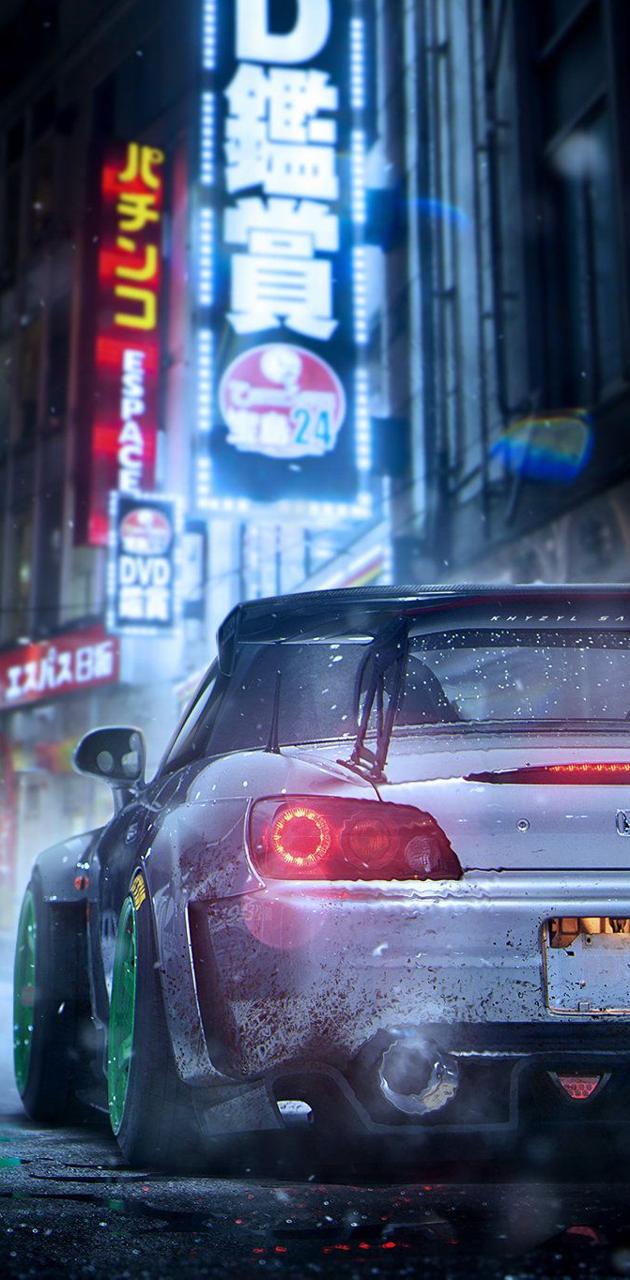 IPhone wallpaper with a sports car in the city at night. - JDM