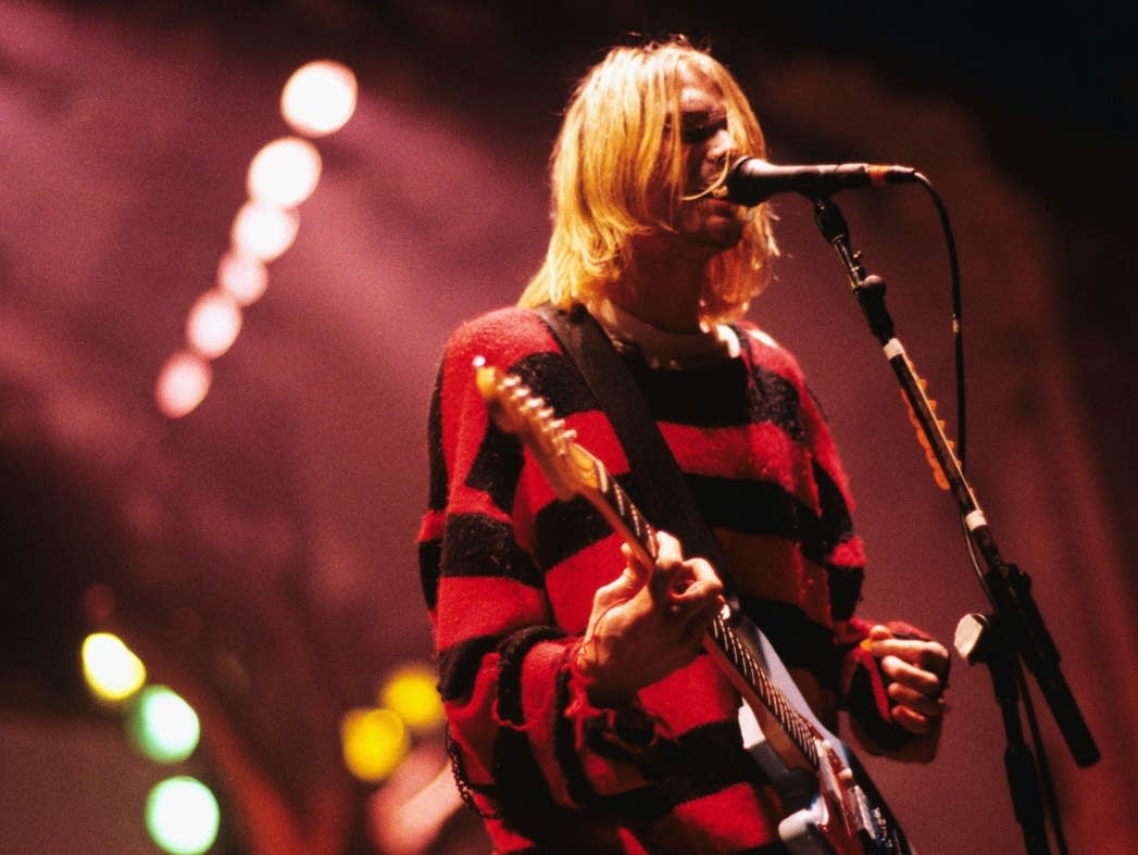 Kurt Cobain of Nirvana performing at the Reading Festival in 1992. - Nirvana