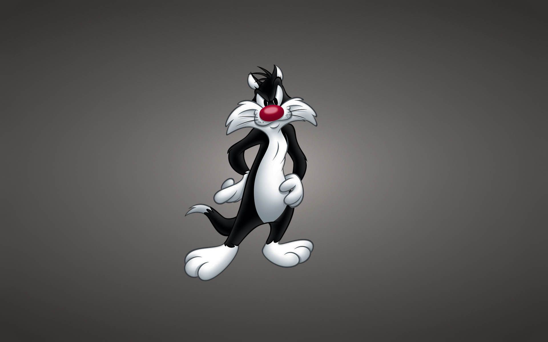 A cartoon cat with red nose and black fur - Looney Tunes