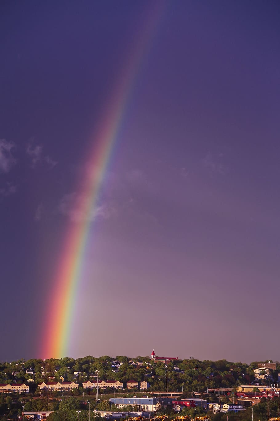 A rainbow is seen over the city - Rainbows