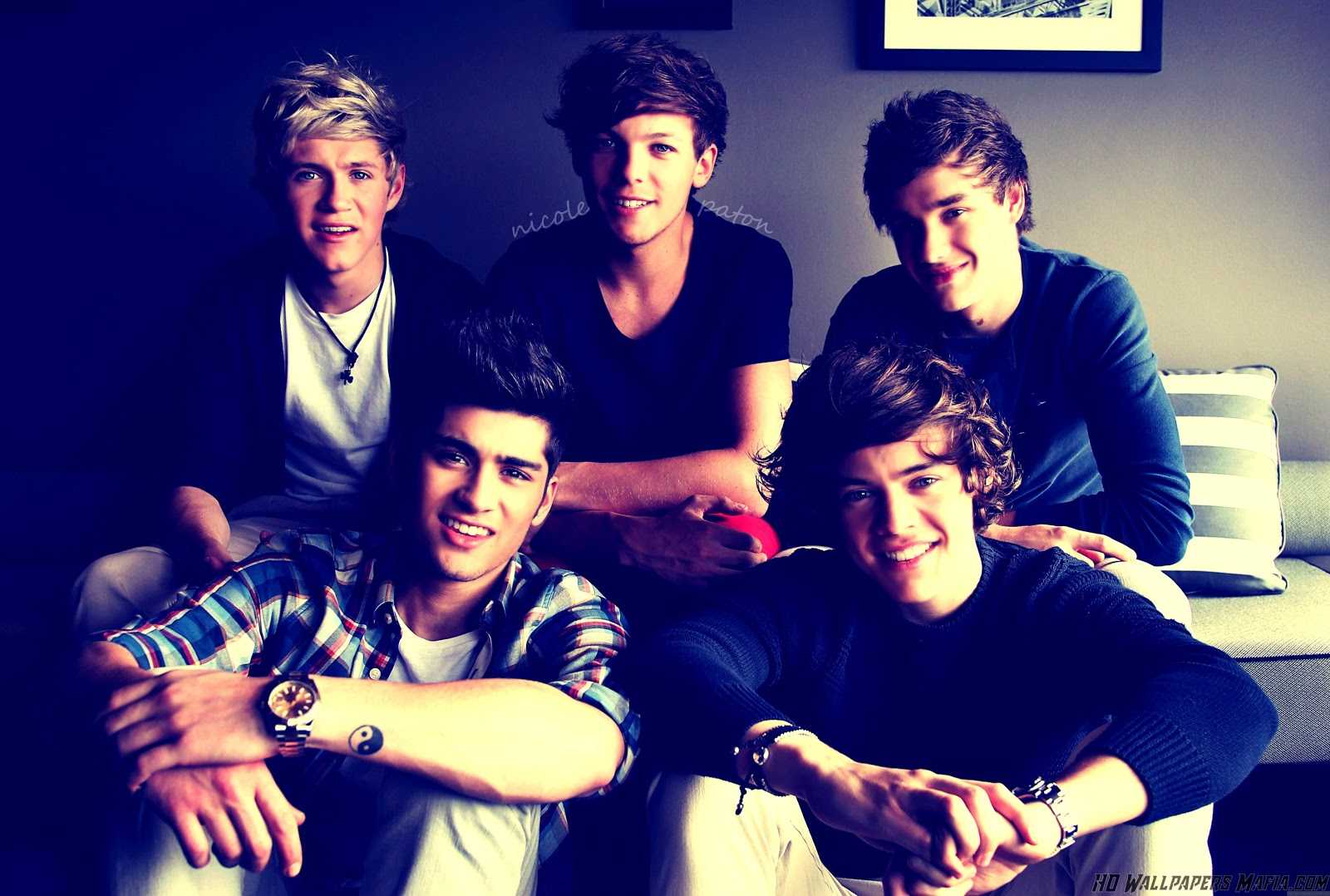 A group of young men sitting on the couch - One Direction