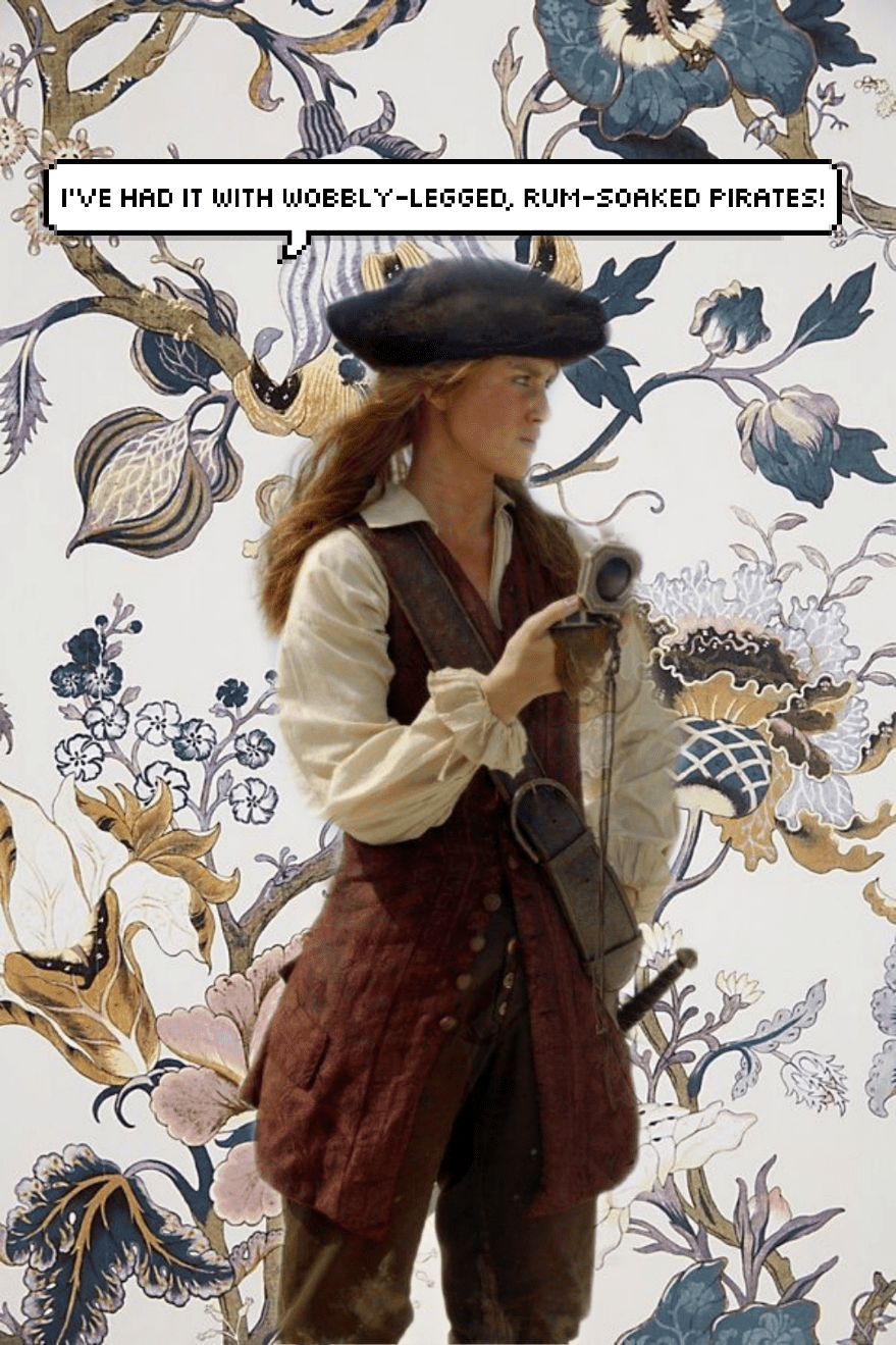 A woman in a pirate costume, standing in front of a flowery wallpapered background. - Pirate