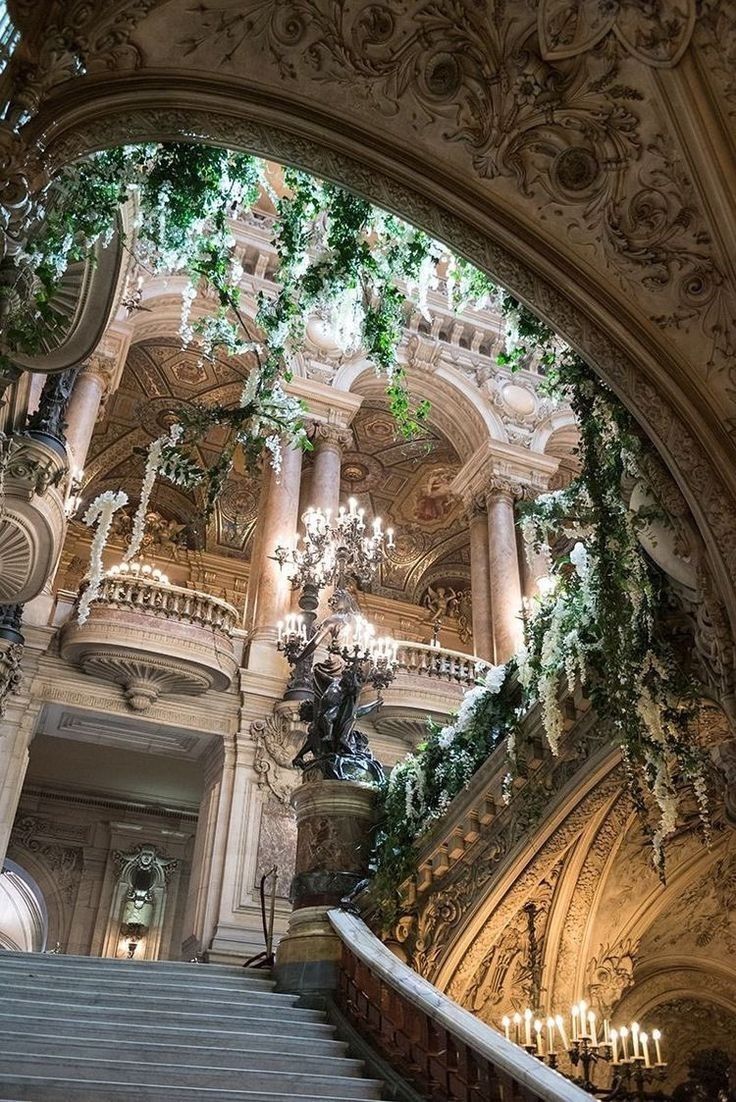 A staircase in an ornate building with plants - Royalcore, castle