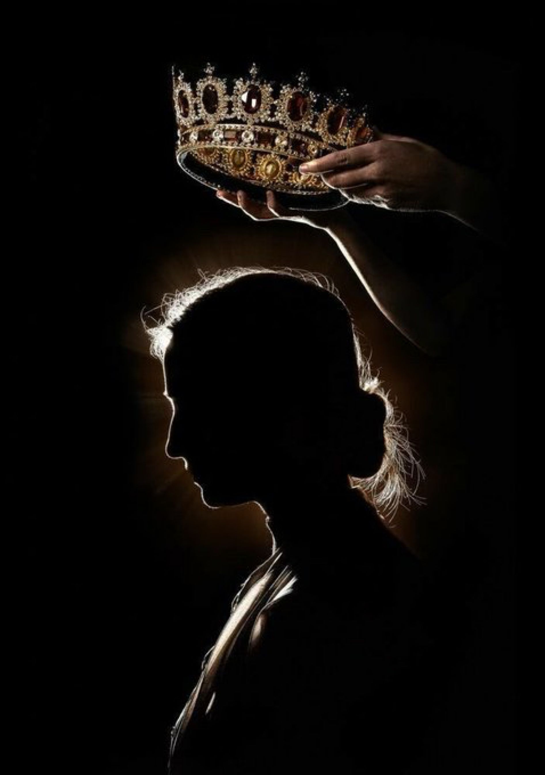 A woman's silhouette with a crown being placed on her head. - Crown
