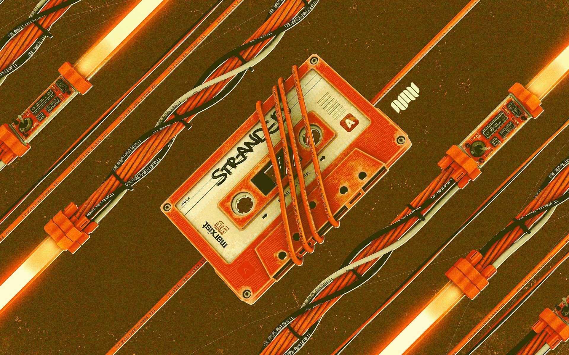 An orange cassette tape with the word 