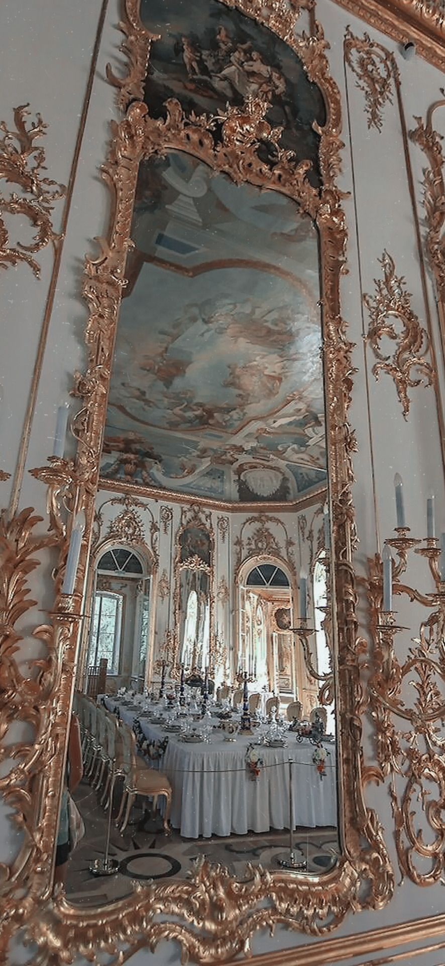 A fancy room with mirrors and chandeliers - Royalcore