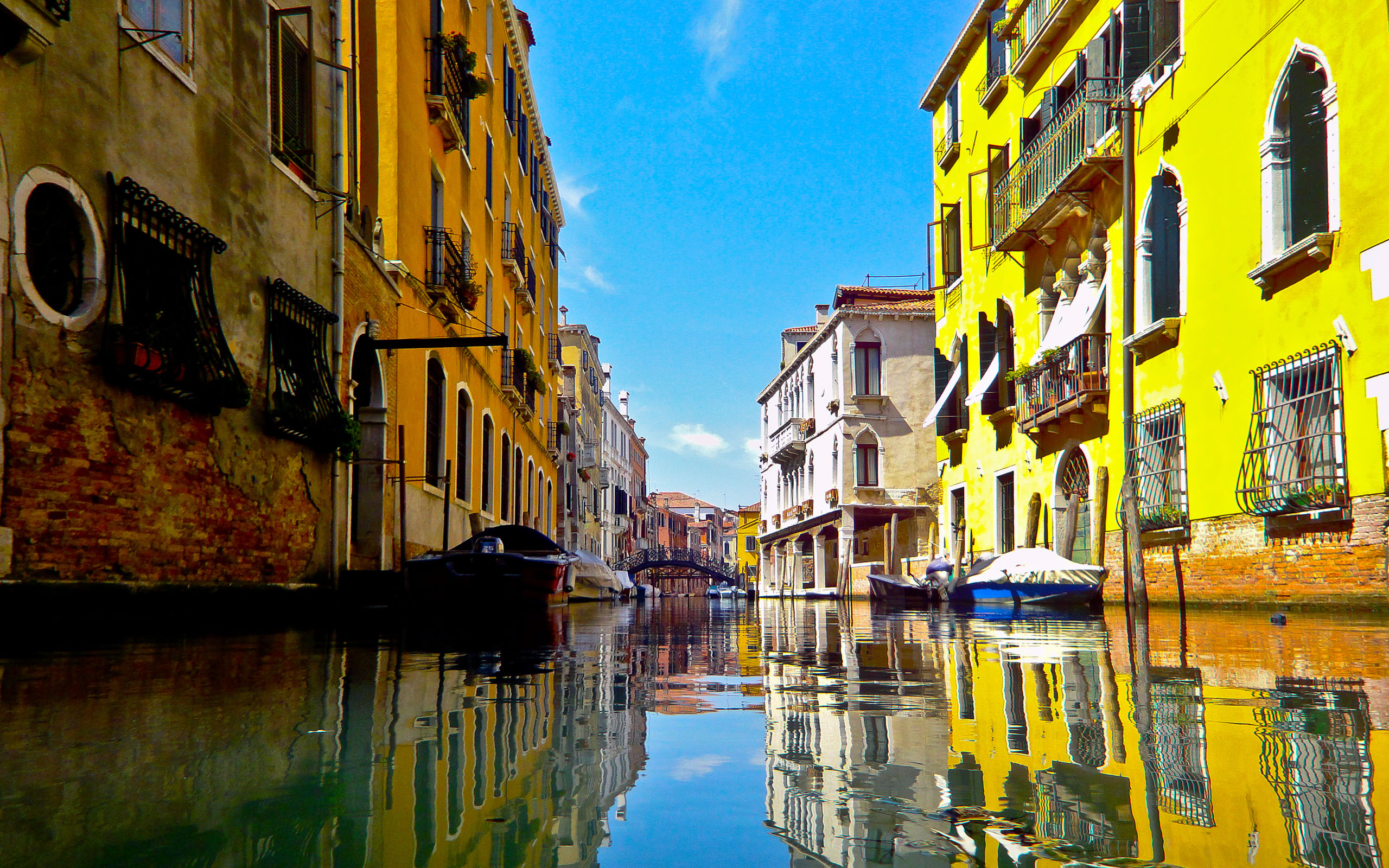 As a canal with buildings on either side - Italy