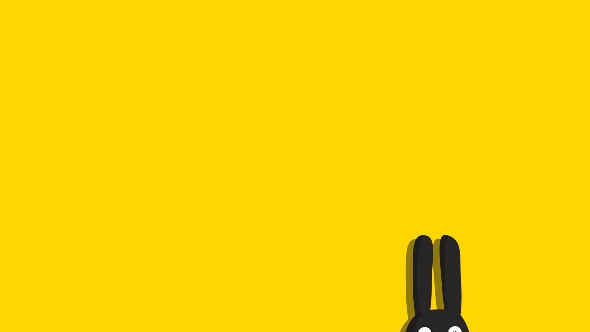 A black rabbit on yellow background - Korean