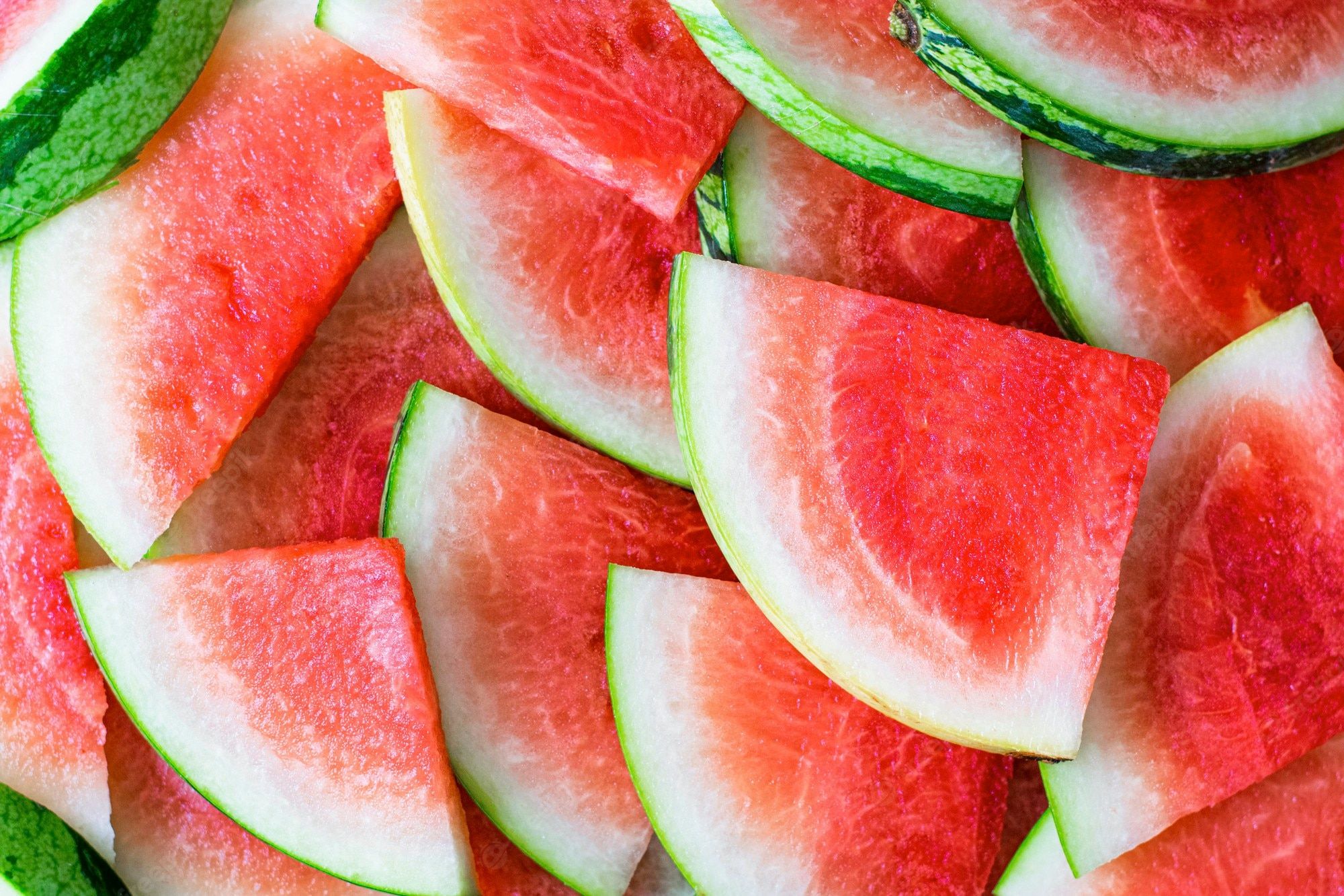 A close up of watermelon slices on top - Watermelon