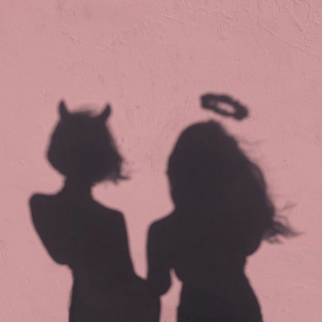 Two shadows of a woman with horns and an halo - Shadow