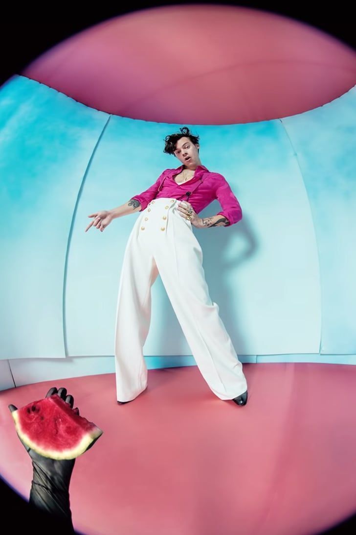 A woman in white pants and shirt holding watermelon - Watermelon