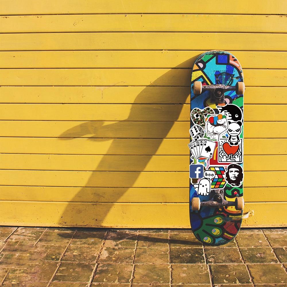 A skateboard leans against a yellow wall. - Skate