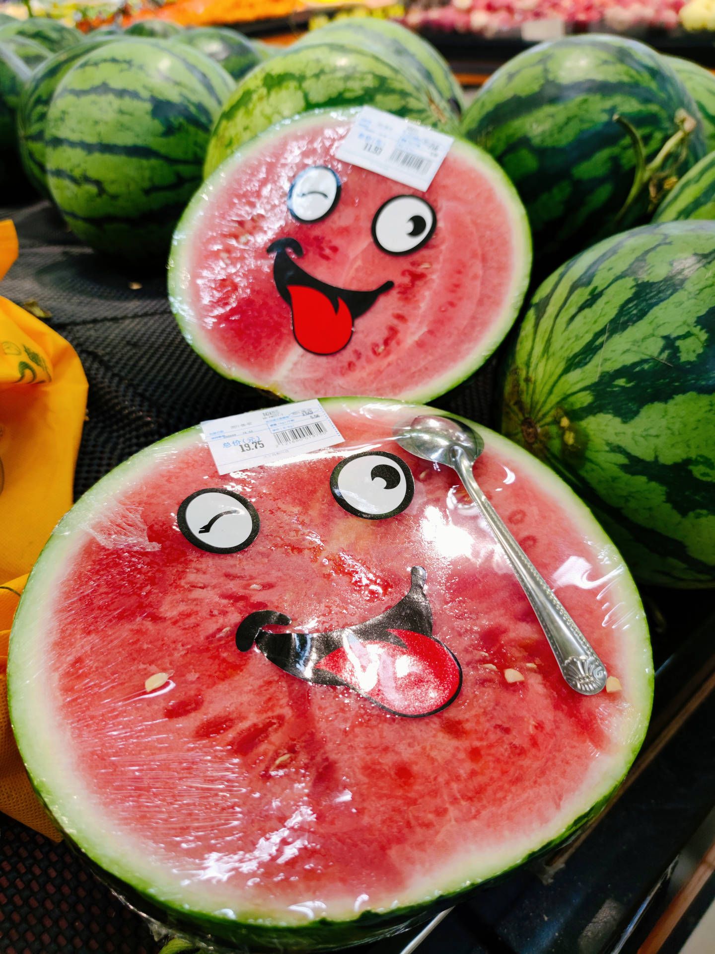 A watermelon with a face drawn on it with a spoon - Watermelon