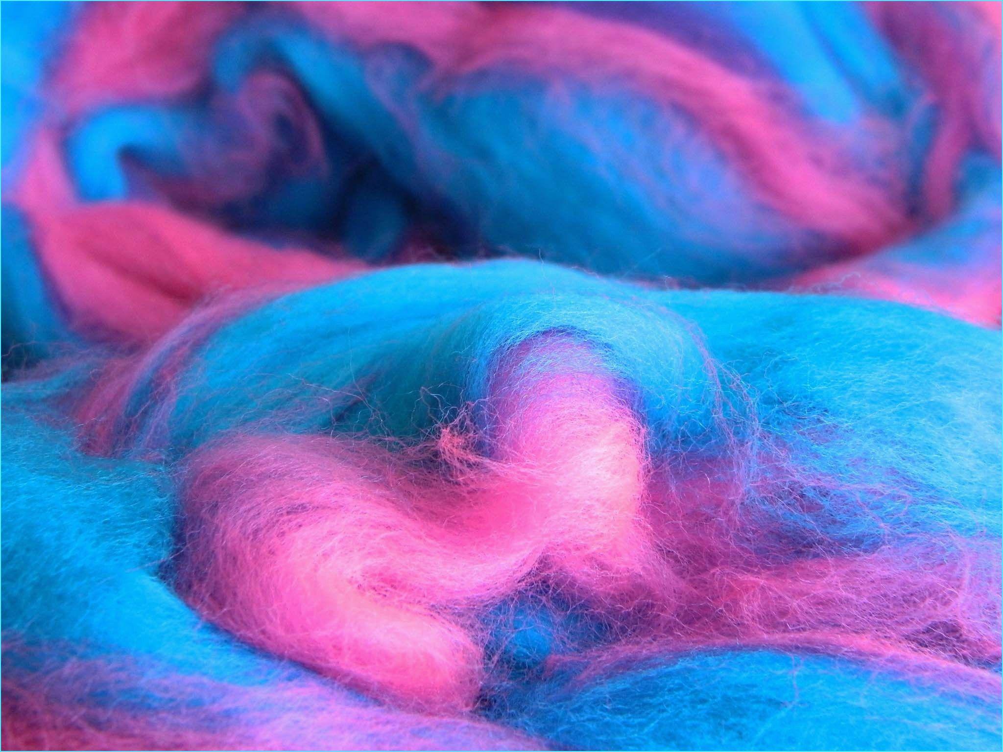 A close up of a pile of pink and blue wool - Candy