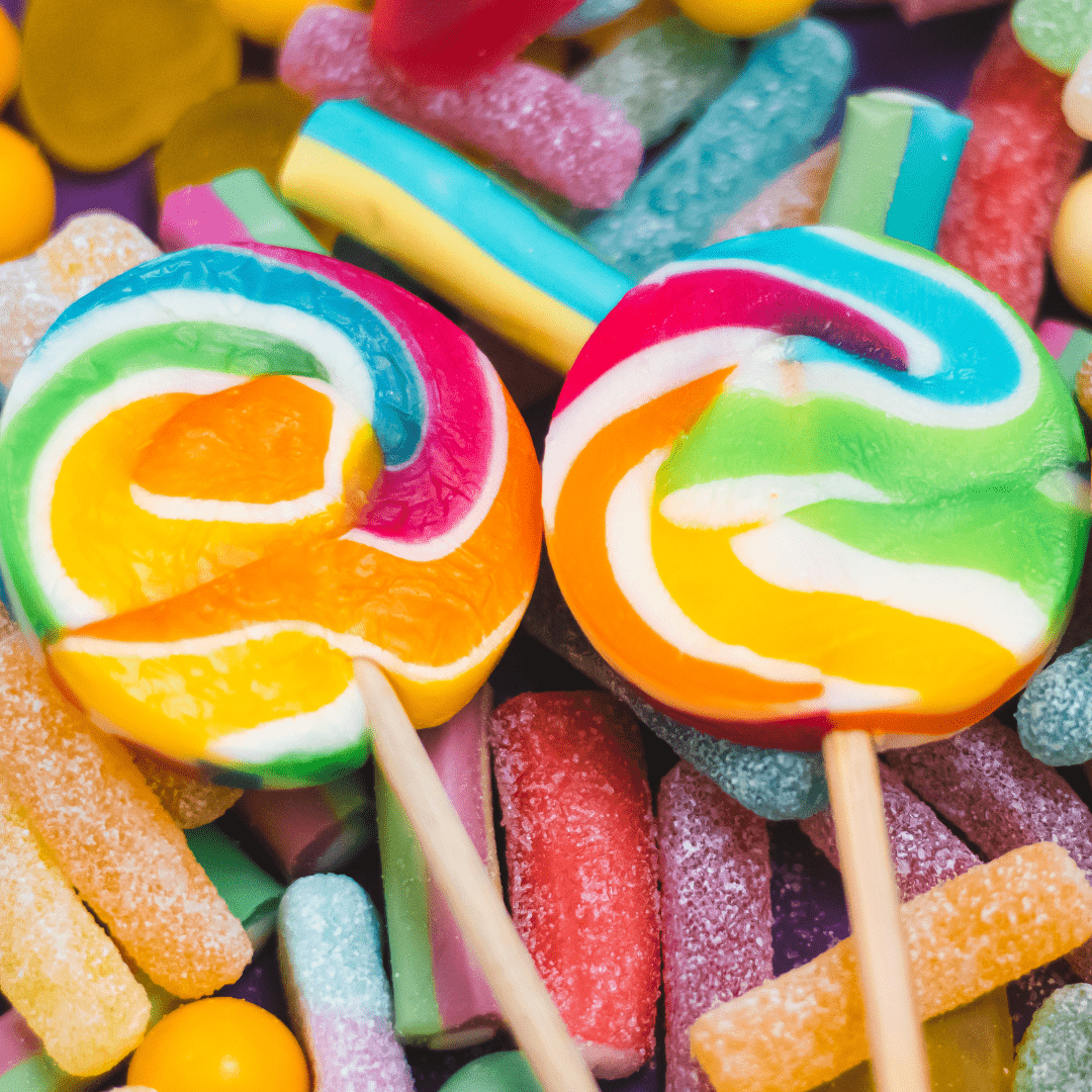 A close up of some lollipops and candy - Candy