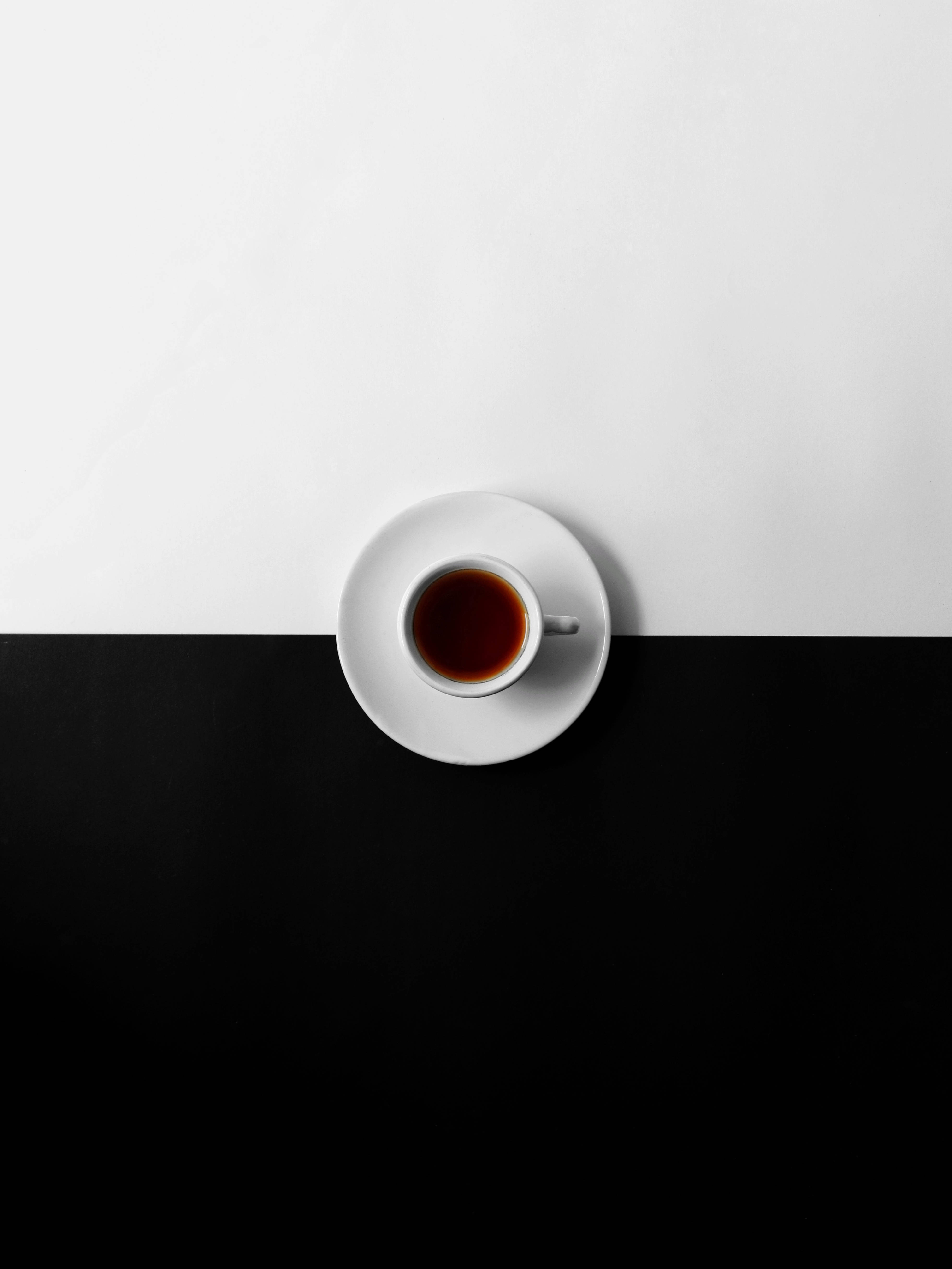 A cup of tea on top an empty plate - Coffee