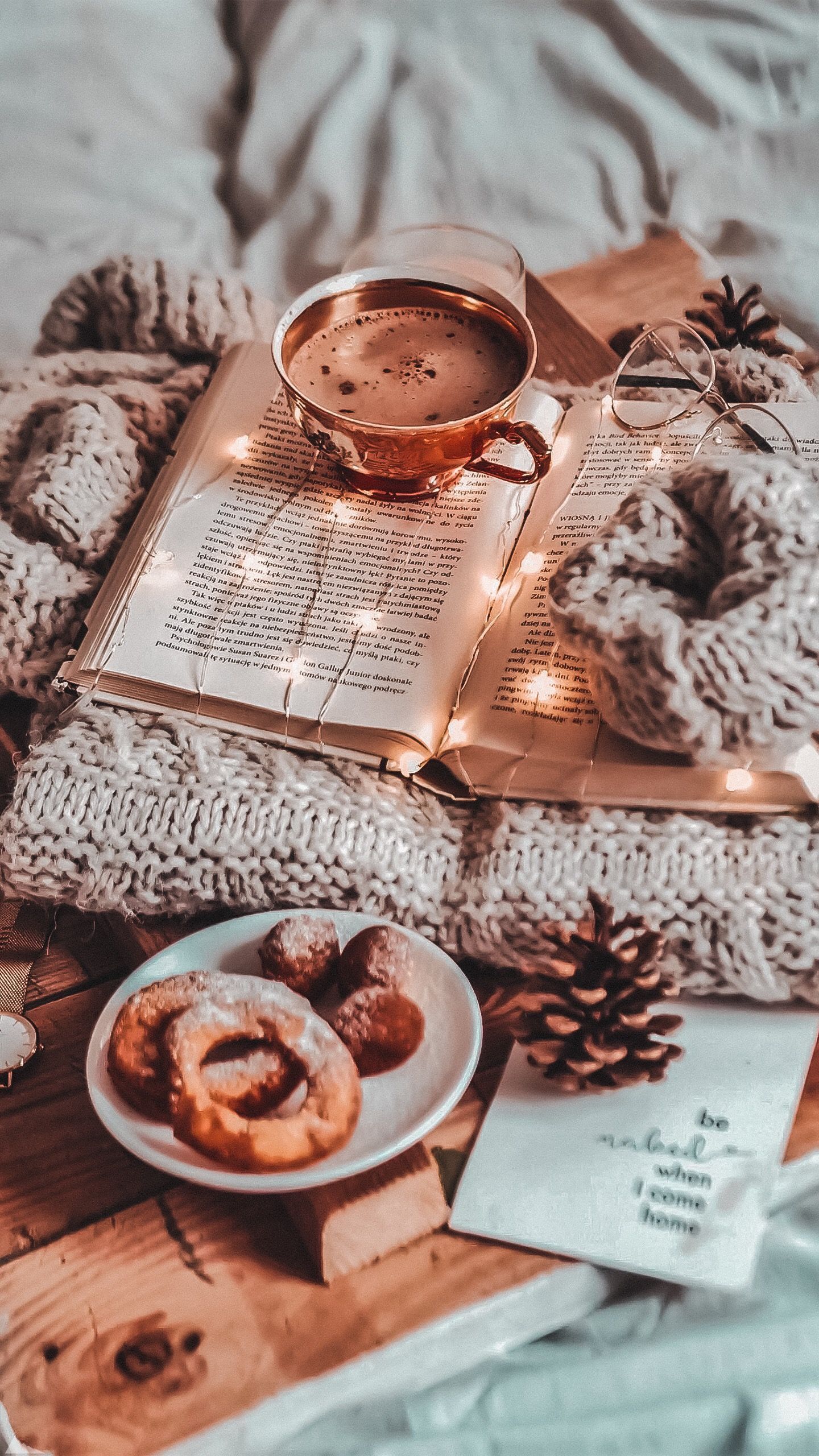 A cup of coffee and some donuts on top - Cozy