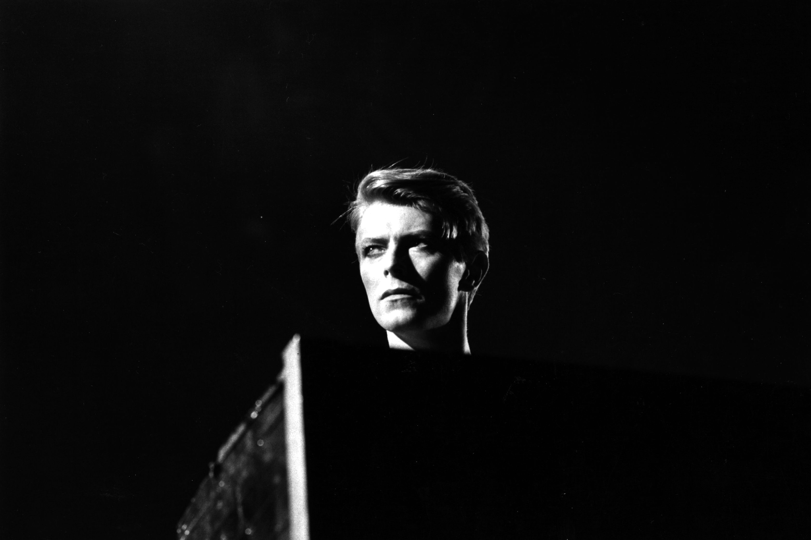 David Bowie in a black and white photo - David Bowie