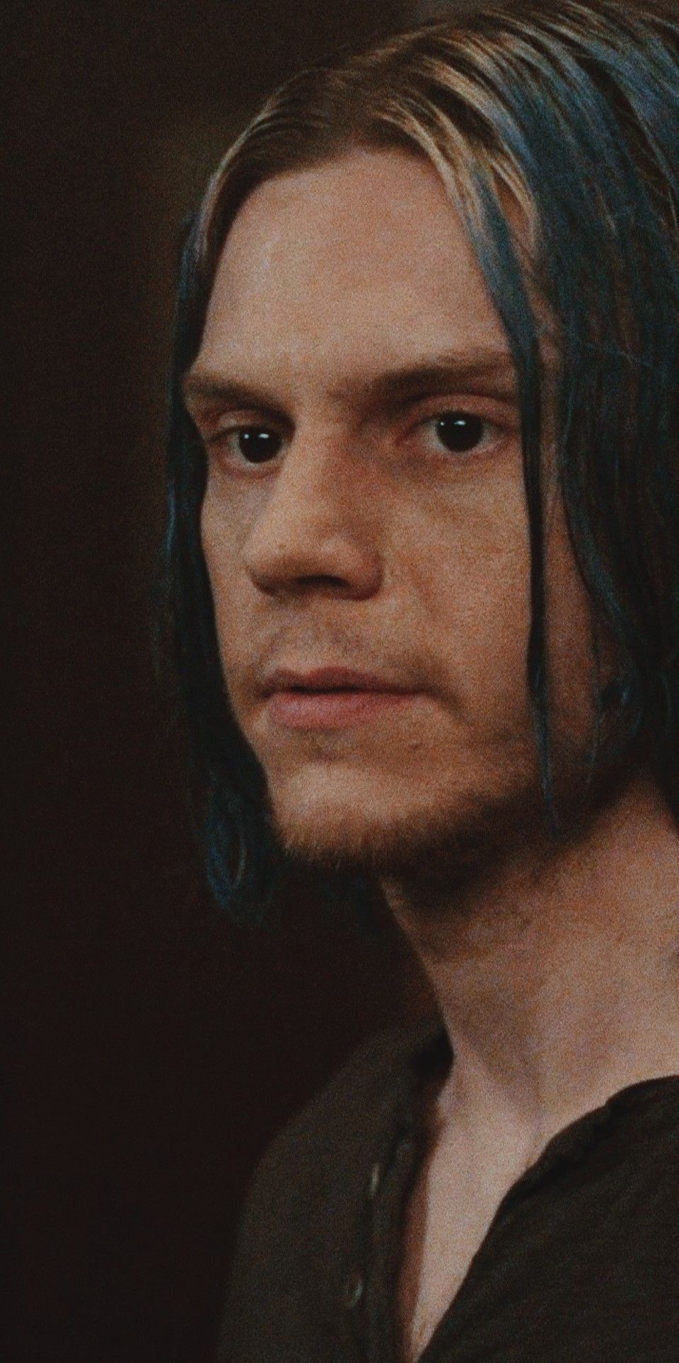 Blue hair guy looking to the side - Evan Peters