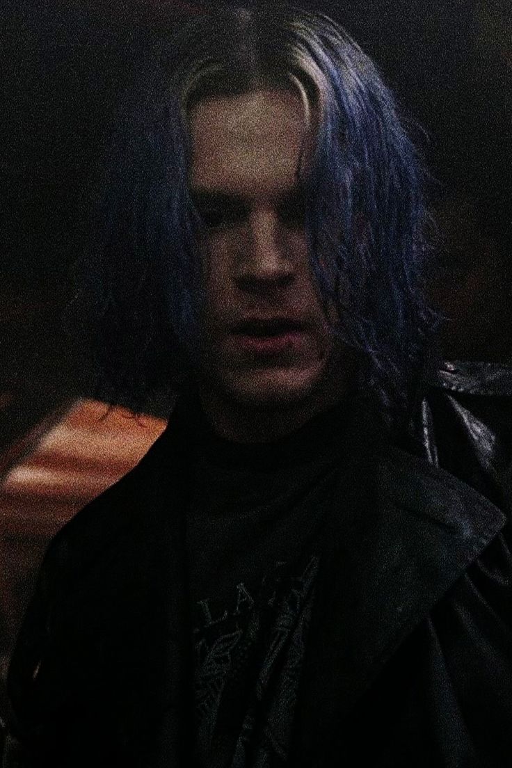 A man with blue hair and black leather jacket - Evan Peters