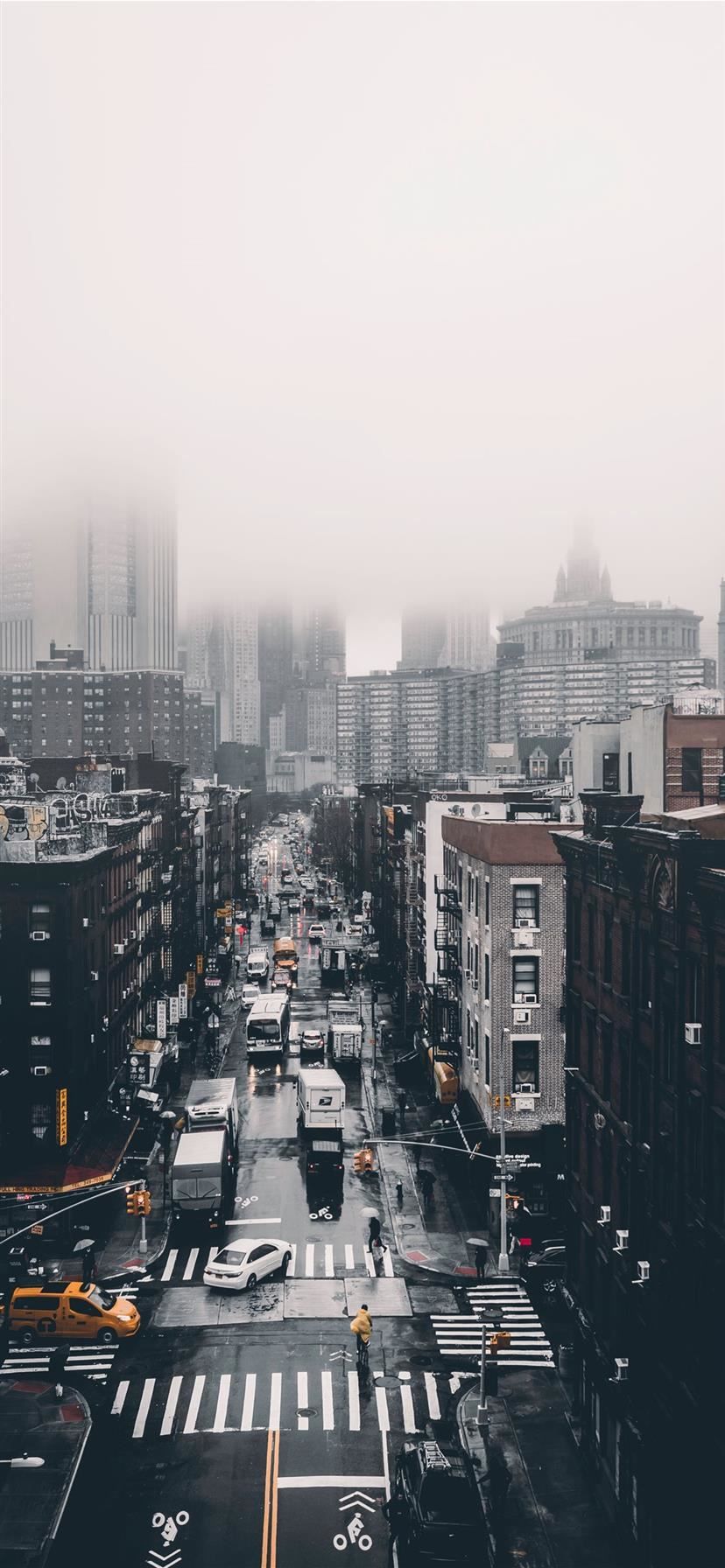 A city street with cars and buildings - Fog, city