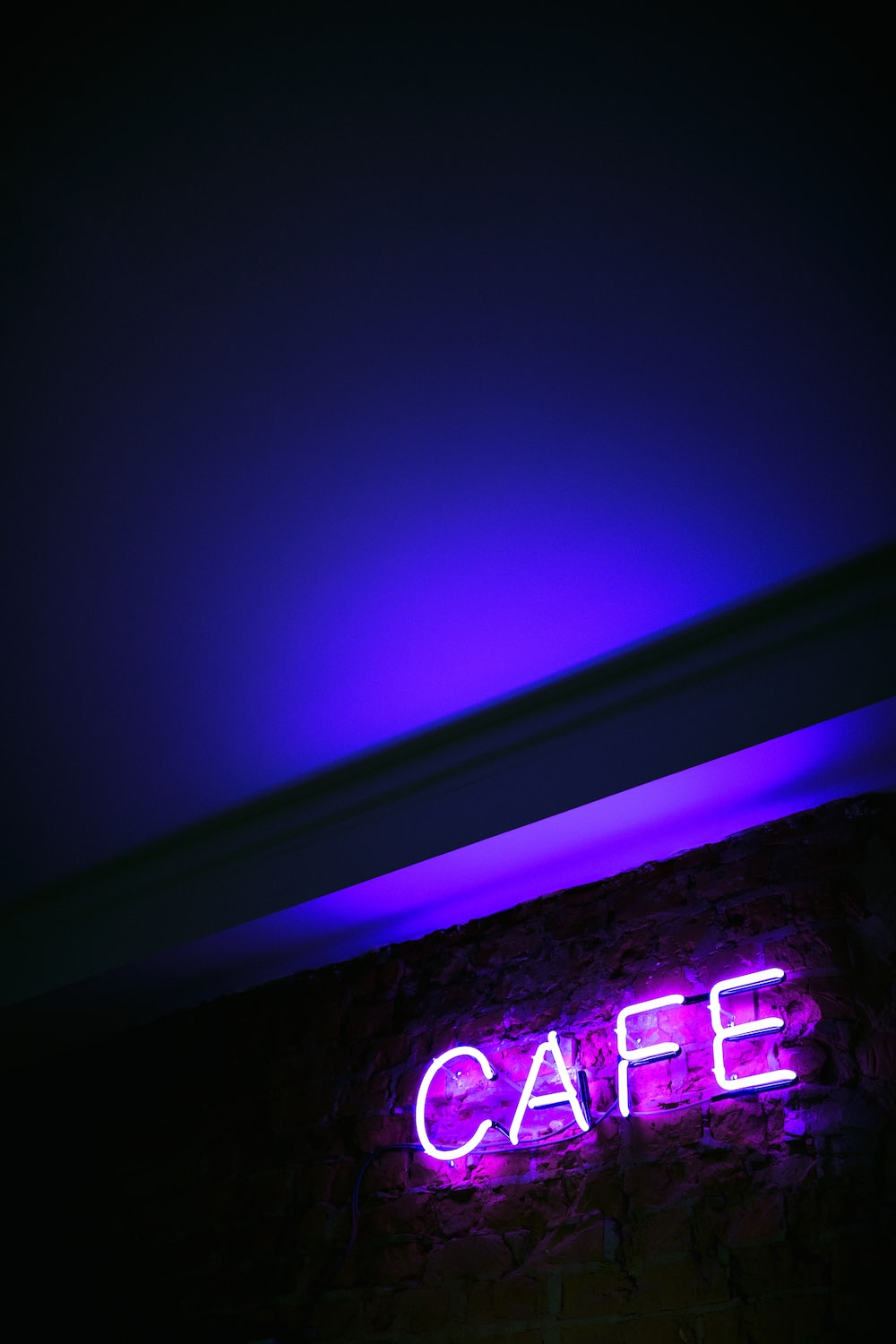 A purple neon sign that says 