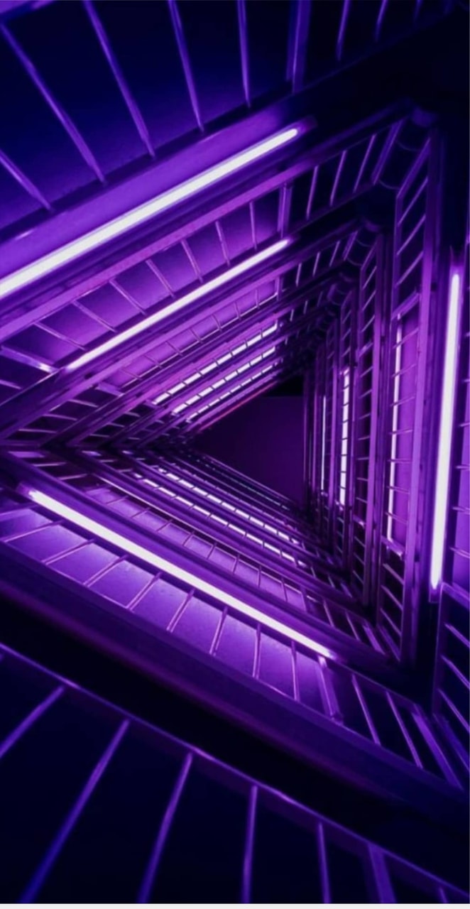 An image of a staircase with purple lights - Neon purple