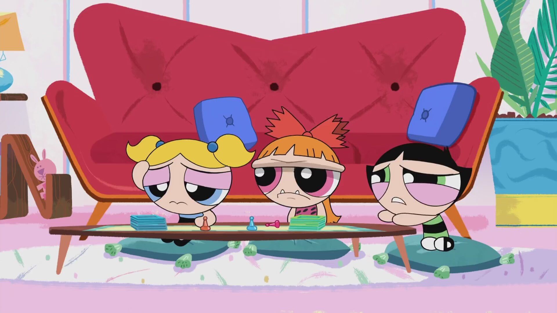 The Powerpuff Girls are sitting on the floor with their heads tilted to the side. - The Powerpuff Girls