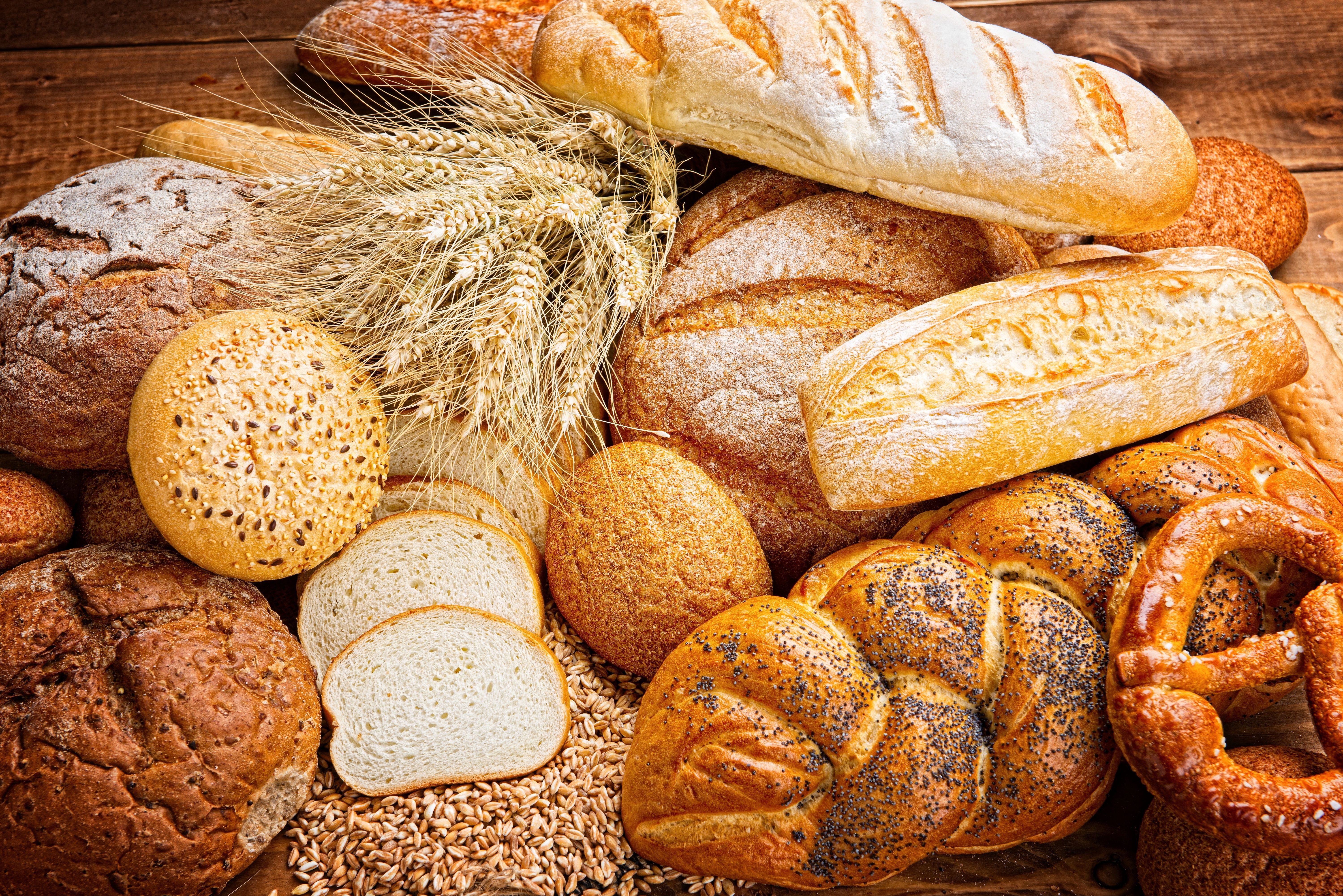 A bunch of bread and rolls on the table - Bakery