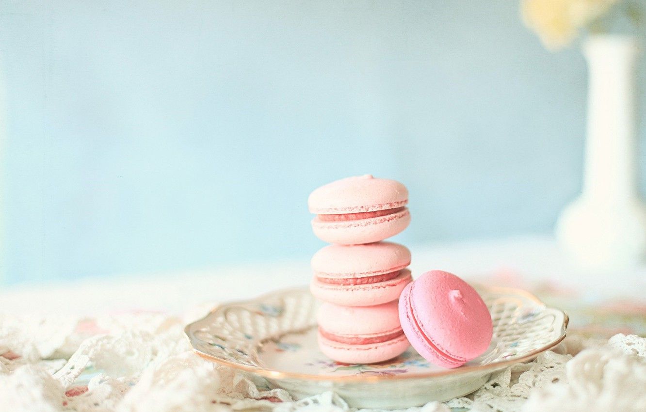 A plate with some pink macaroons on it - Bakery