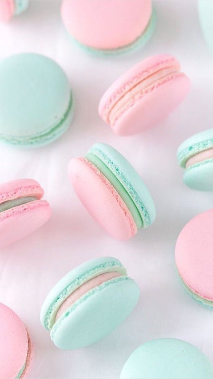 A bunch of macaroons on a white table. - Bakery