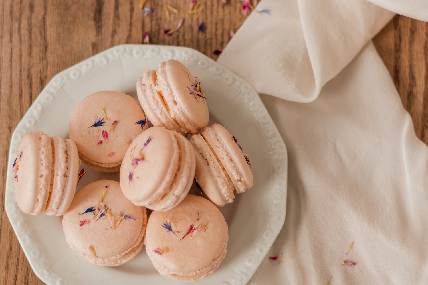 Macarons on a white plate with a napkin - Bakery