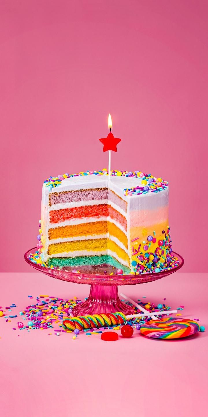 A birthday cake with a slice missing and a star on a stick in the center. - Birthday, cake