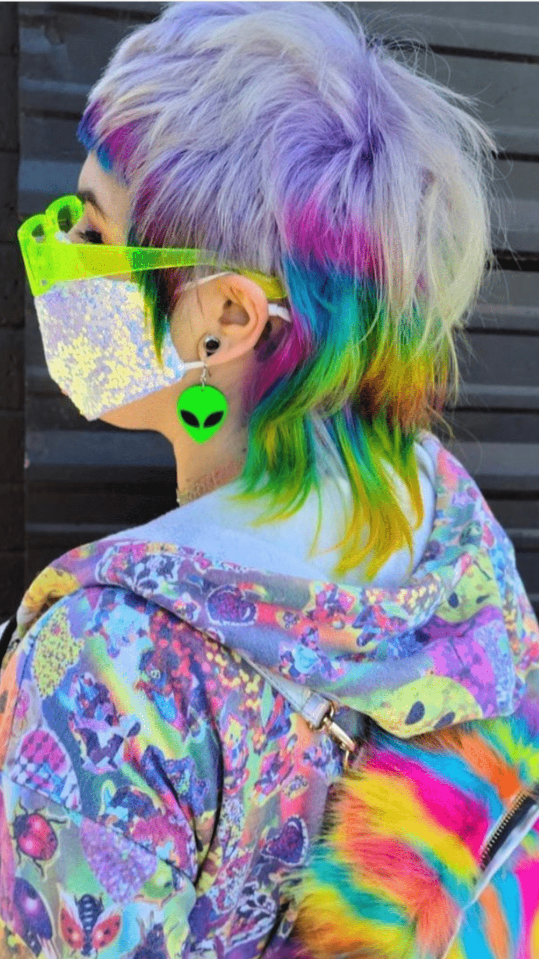 A woman with colorful hair wearing an eye mask - Punk