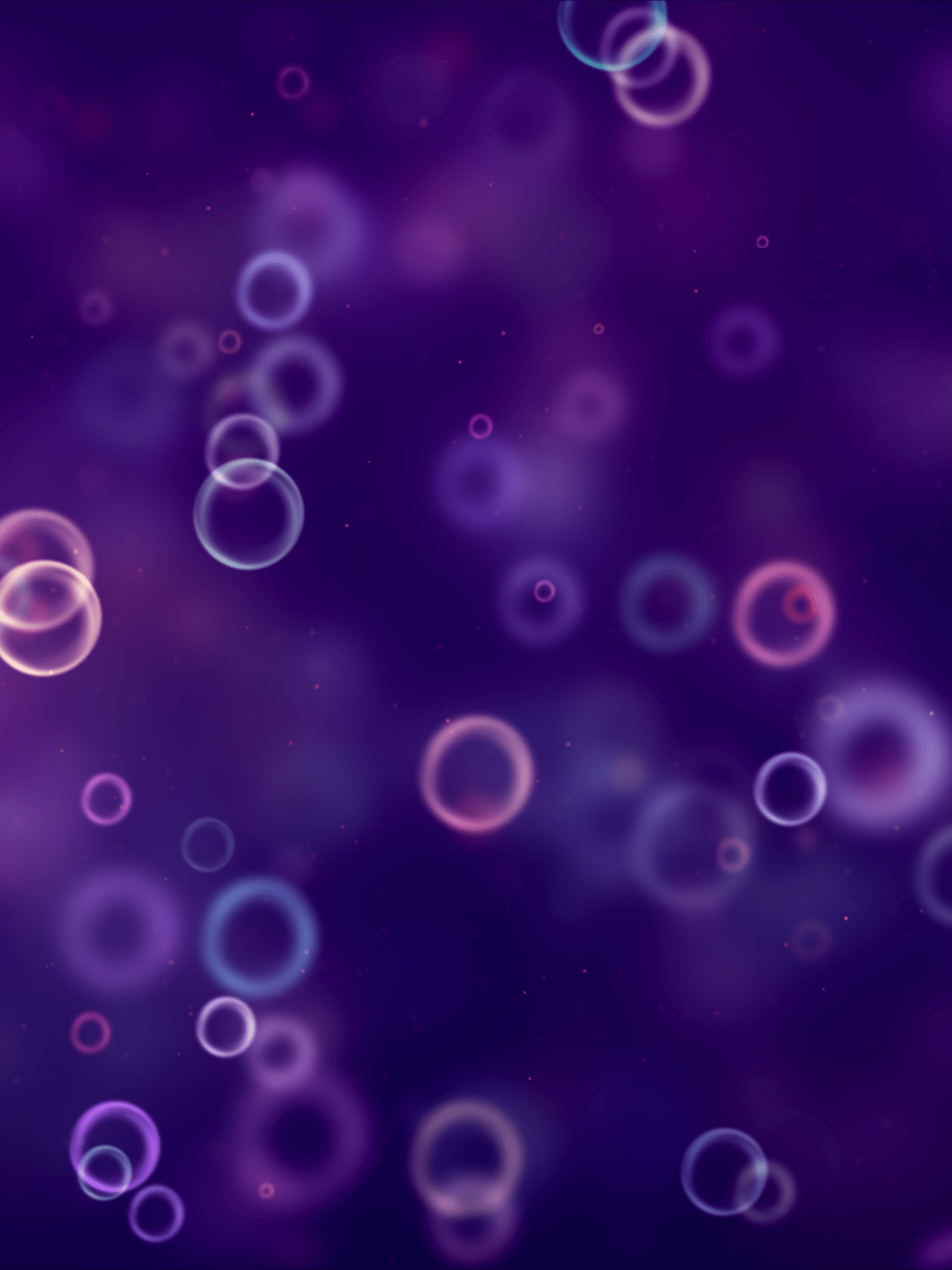 A purple image with many floating spheres of varying sizes - Bubbles