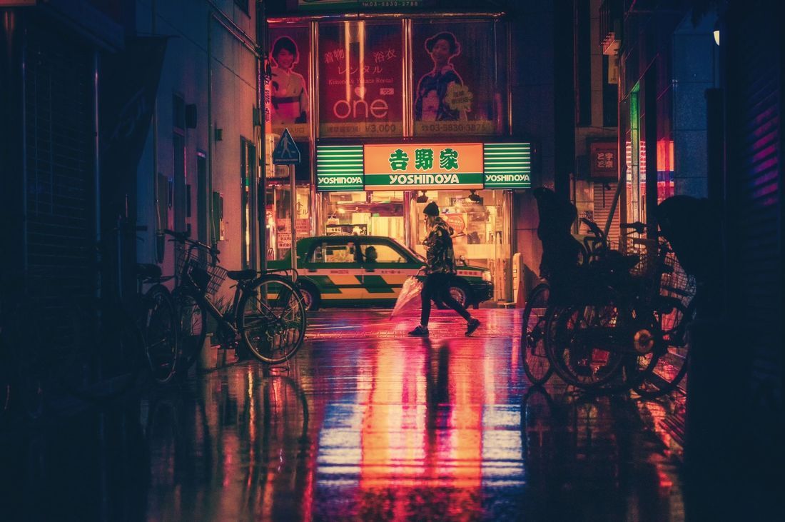 A person crossing the street in Tokyo at night. - Beautiful