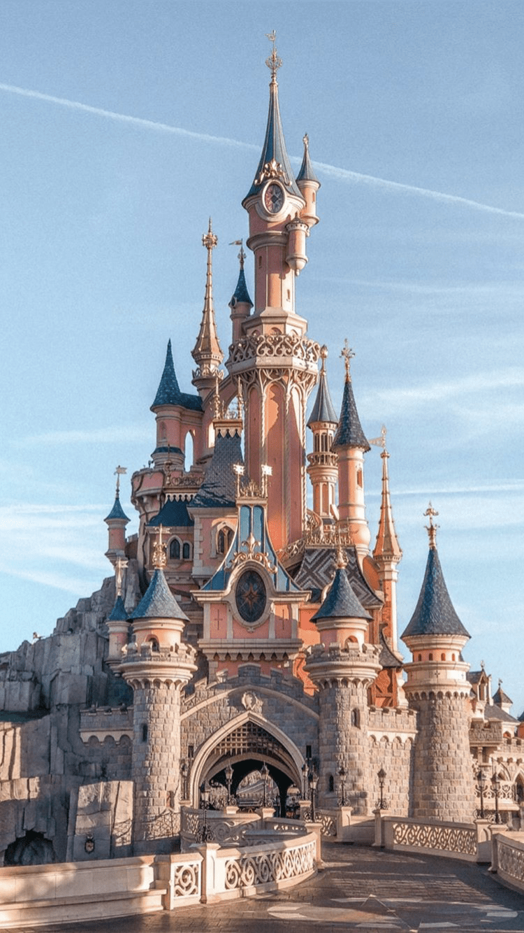 Disneyland Paris castle with blue sky in the background - Castle, Disneyland