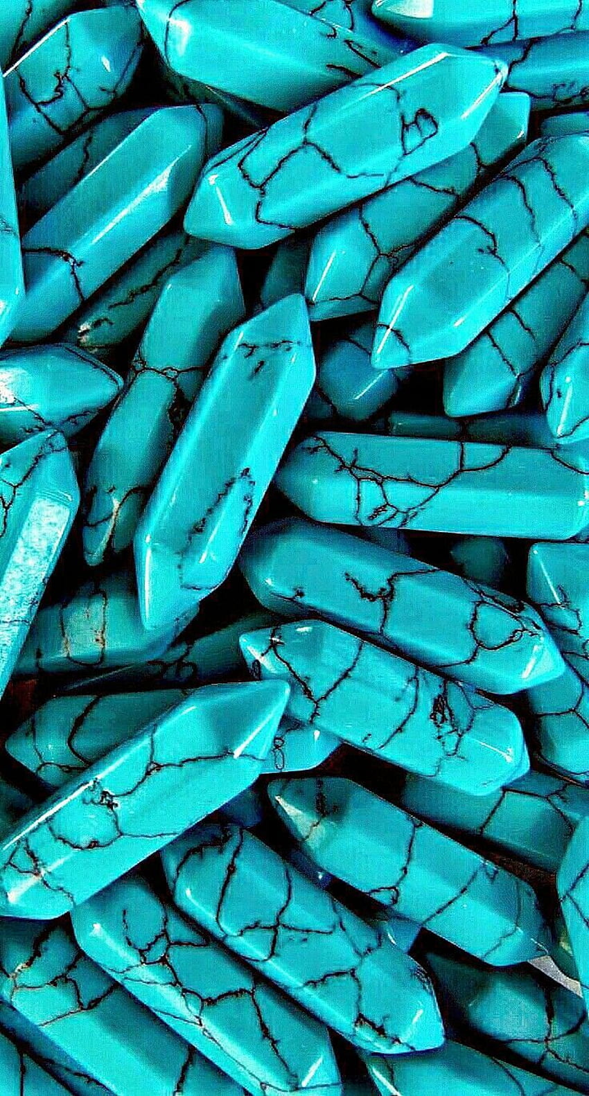 A close up of turquoise colored beads - Turquoise