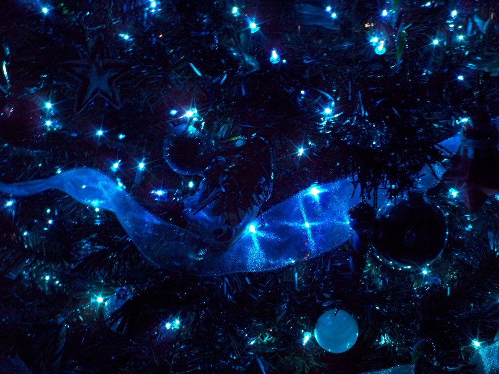 A blue Christmas tree with blue ornaments and a blue ribbon. - Christmas lights, fairy lights