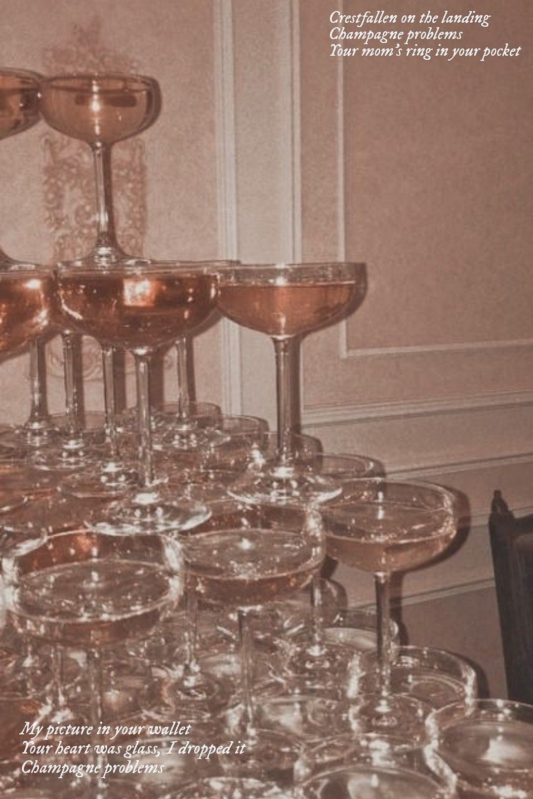 A tower of wine glasses on a table. - Champagne