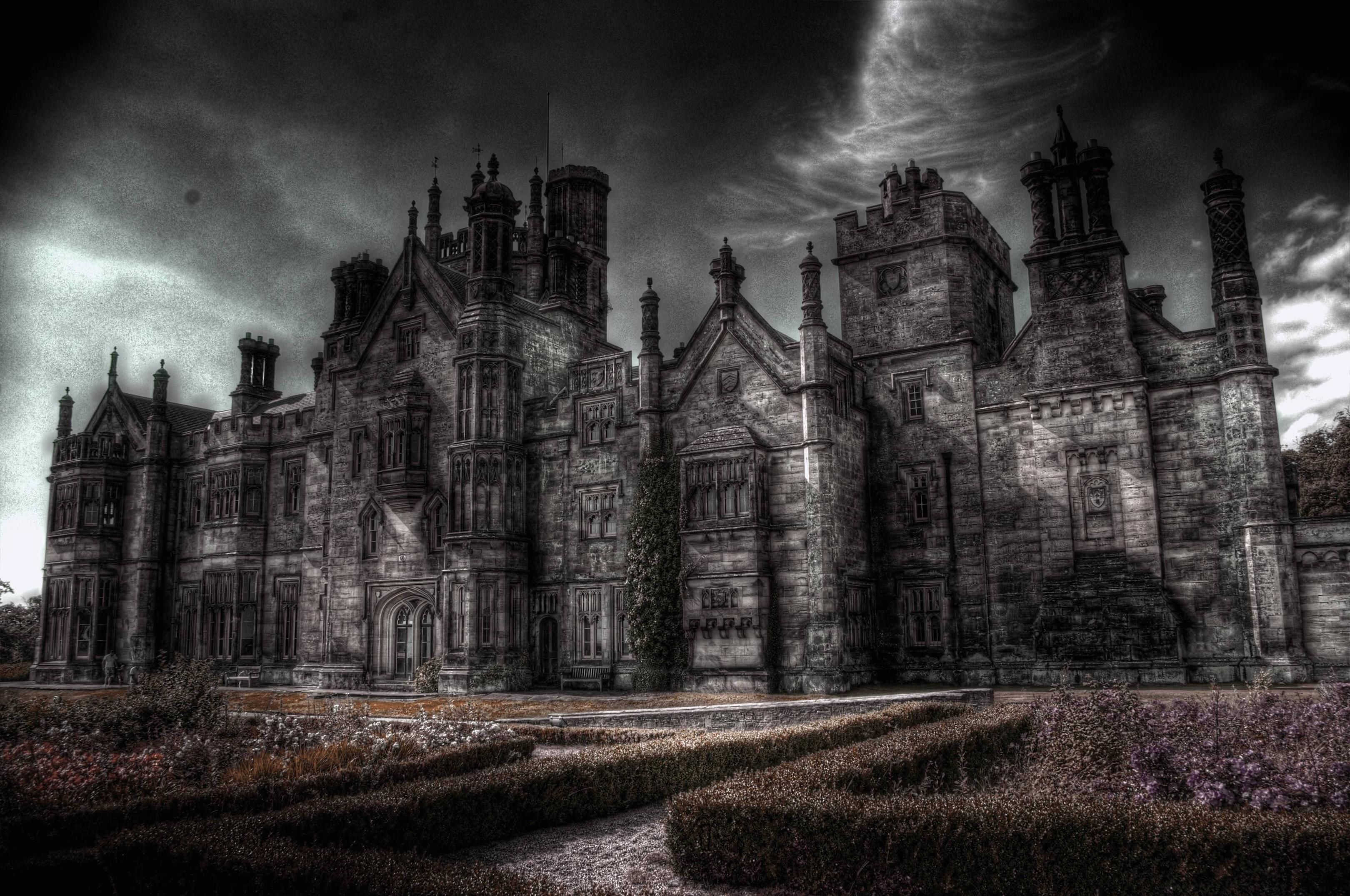 A dark and eerie castle with a moody sky above. - Castle, gothic