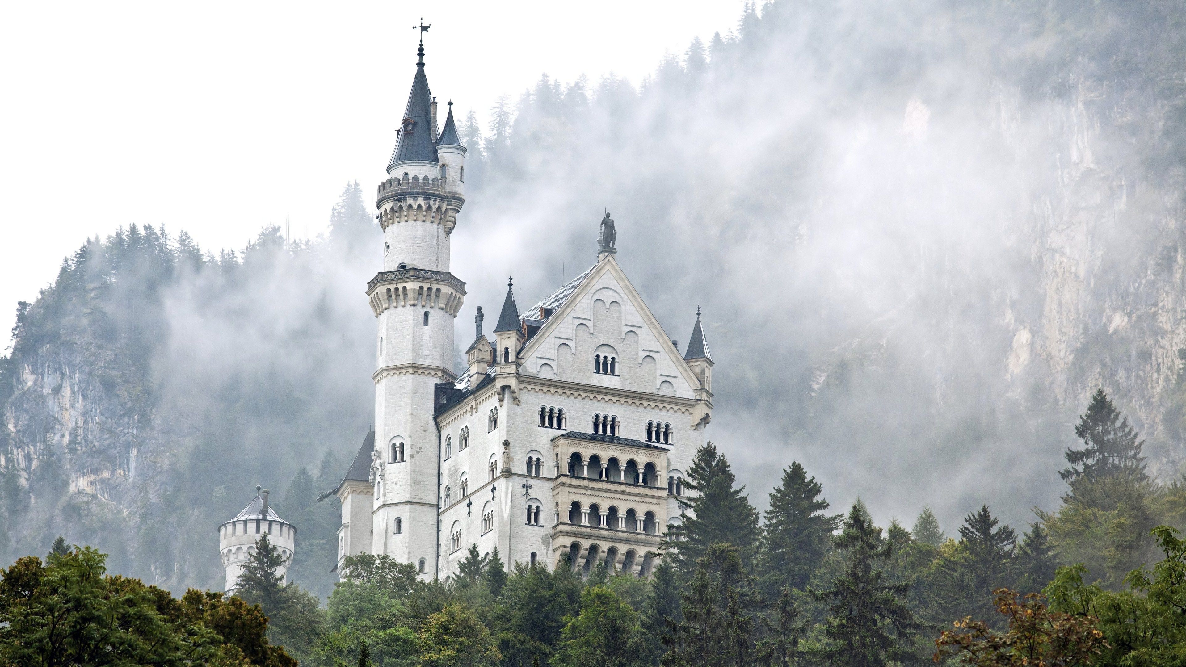 Neuschwanstein Castle is a 19th-century Romanesque Revival palace on a rugged hill above the village of Hohenschwangau near Füssen in the German Alps. - Castle