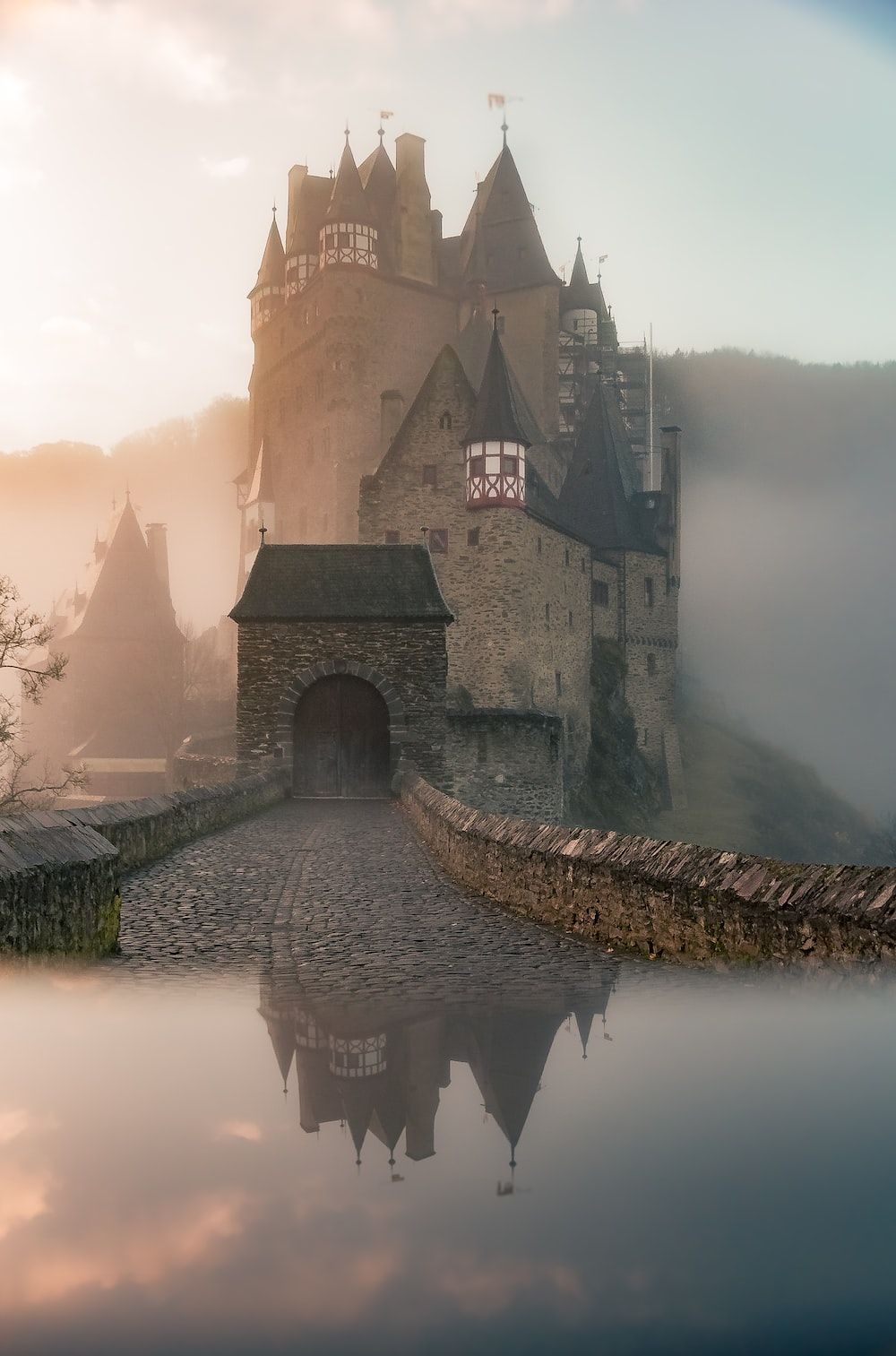 reflection of a castle surrounded with fogs photo