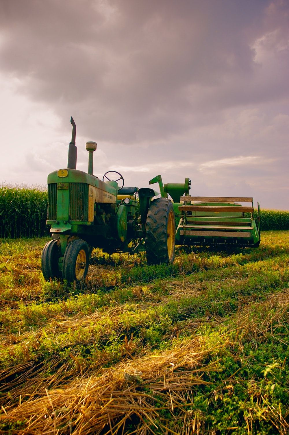 A tractor is parked in the middle of an open field - Farm