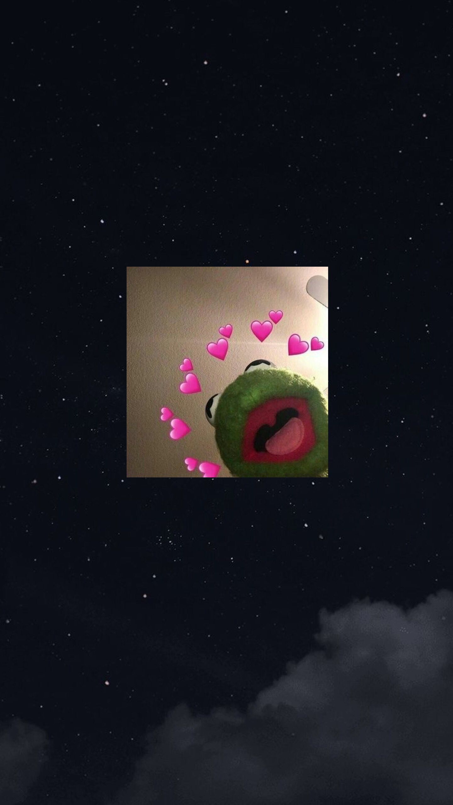 A picture of an animal with hearts around it - Kermit the Frog