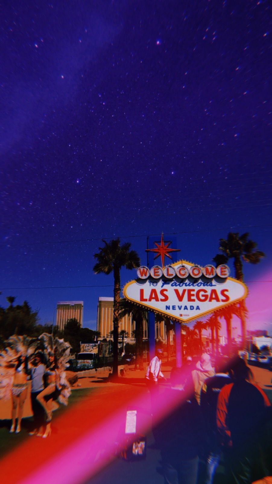 Las Vegas sign at night with a pink and blue filter - Las Vegas
