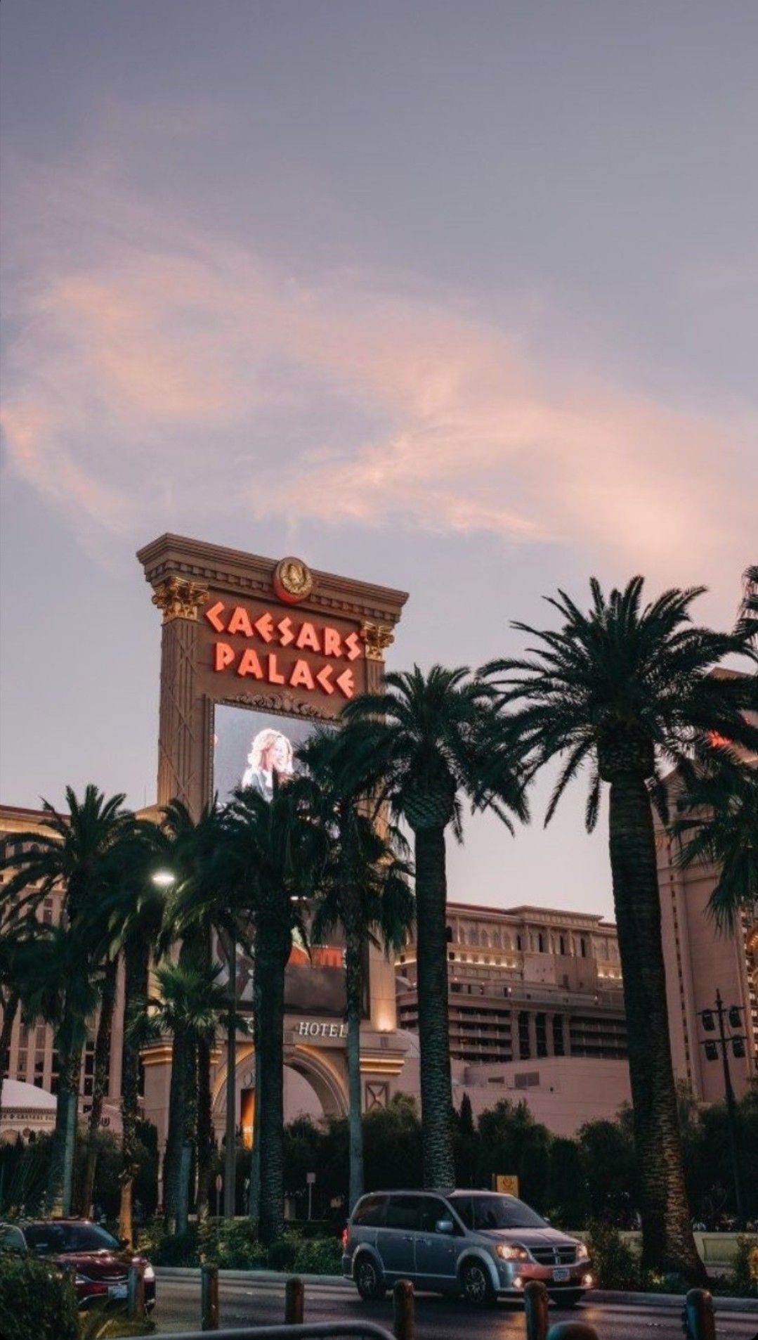 A hotel with a sign that says Caesar's Palace. - Las Vegas