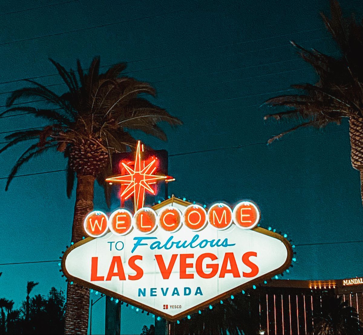 A sign that is lit up at night - Las Vegas